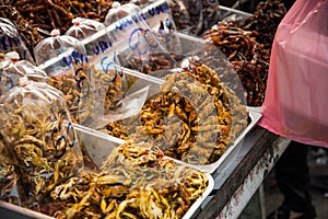 Very spicy seafoods beside the roa