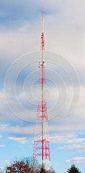 Very Tall Antenna Tower in Sky Clouds