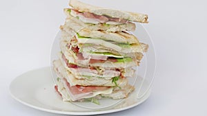 Very tall sandwich on white isolated background close-up. big sandwich on white background