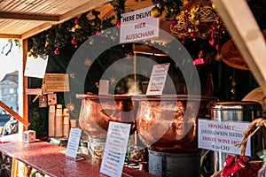 Very tasty hot gluhwein or mulled wine in two cauldrons on fire in the Christmas market around the Grossmunster Church, Canton of