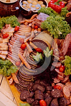 Very tasty meat buffet inrustic style with herbs and vegetables. Tourism and travel. Traditional national cuisine. Breakfast at photo