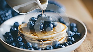 very tasty vegan blueberry pancakes, blueberries on top of pancakes and around, for the restaurant menu