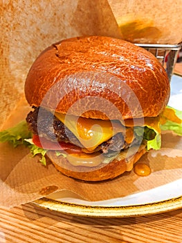 very tatty hamburger on a plate photo