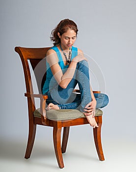 Very Thoughtful Young Woman Sitting