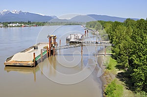 Vessel for a cement plant anchored at a river port