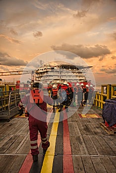 Marine crew get ready during arrival at accommodation work barge