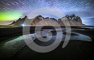Vestrahorn mountain with Aurora borealis and startrails, Iceland