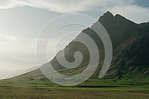 Vestrahorn mountaine on Stokksnes cape in Iceland during sunset. Amazing Iceland nature seascape.