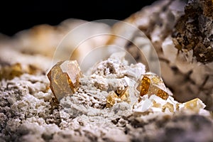 Vesuvianite crystal (known as idocrase too) on white matrix macro detail texture background photo