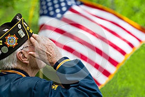 Veteran Salutes the US Flag photo
