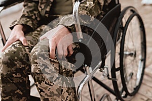 Veteran in wheelchair returned from army. Close-up photo veteran in a wheelchair.