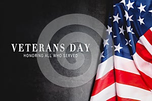 Veterans day. Honoring all who served. American flag on gray background with copy space