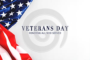 Veterans day. Honoring all who served. American flag on gray background with copy space