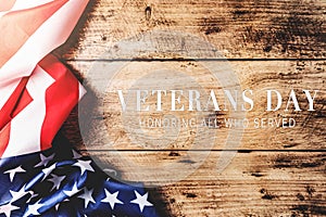 Veterans day. Honoring all who served. American flag on wooden background