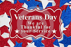Veterans Day message with red, white and blue glitter stars