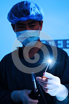 Veterinarian doctor in operation room for laparoscopic surgical (art lighting shot)