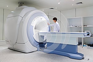 Veterinarian doctor working in MRI room photo