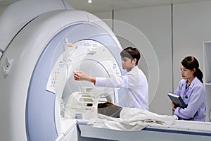 Veterinarian doctor working in MRI room photo
