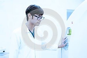 Veterinarian doctor working in MRI scanner room