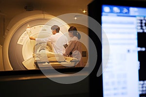 Veterinarian doctor working in MRI scanner room photo