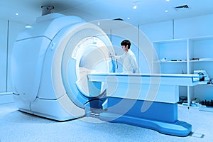 Veterinarian doctor working in MRI scanner room photo