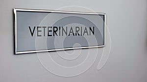 Veterinarian room door, visit to animal doctor for checkup, pets healthcare