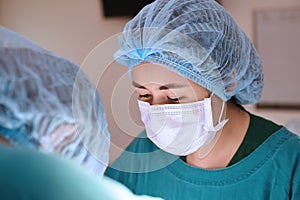 Veterinarian surgeons in operation room photo
