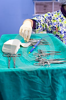 Veterinary surgeon with surgery material