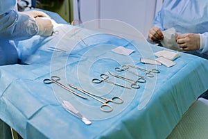 Veterinary surgical instruments lie on the operating table