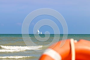 Vew from shore to sailing boats far to the sea, Italy, Riccione