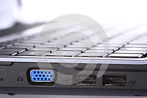VGA and USB ports on side of laptop computer