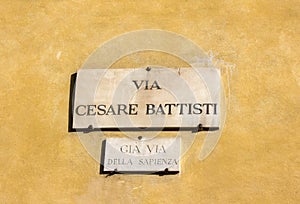 Via Cesare Battisti, street plate on a wall of house in Florence, Italy