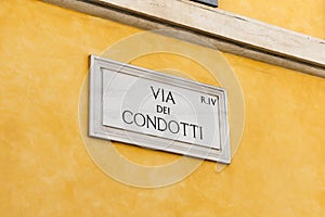 Via Dei Condotti Street Sign in Rome, Italy photo