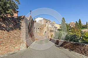 The via del Castello and the ancient walls of the village of Certaldo alto, Florence, Italy, on a sunny day