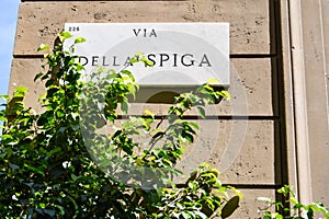 Via della Spiga marble plaque in the high fashion area of Milan photo