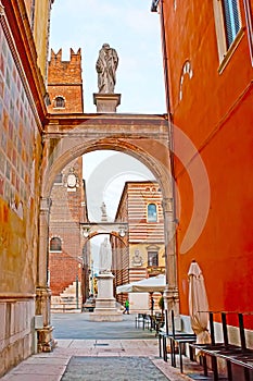 Via delle Fogge street with a view of Dante Monument in Piazza dei Signori square, Verona, Italy