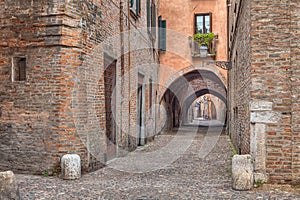 Via delle Volte, medieval alley in Ferrara, Italy photo