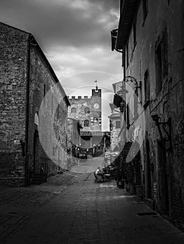 Via Giovanni Boccaccio and the Palazzo Pretorio at the street end in the little town Certaldo in the Tuscany photo