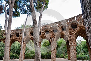 Viaducto arcs and trees in Park Guell at Barcelona