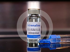 Vial of adrenaline injection with syringe