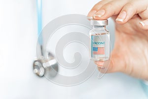 Vial with new usa, american vaccine for covid-19 coronavirus, flu, infectious diseases. Hand of doctor, nurse. Injection after