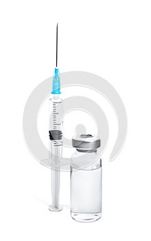 Vial and syringe on background. Vaccination and immunization photo