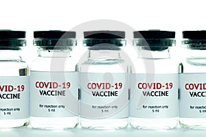 vials of covid-19 vaccine in a row