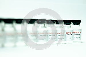 vials of covid-19 vaccine in a row