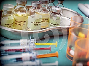 Vials of different size with medication used for neurodegenerative diseases, conceptual image