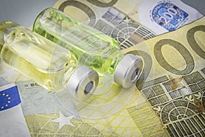 Vials with different substances over euros