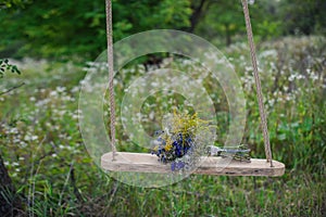 Vibrant bouquet of flowers outdoors on a swing, gift, valentines day, lifestyle-concept