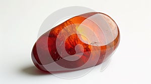 Vibrant Carnelian stone displaying its deep orange-red allure, highlighted against a stark white background