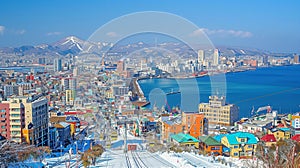 Vibrant Coastal City with Snowy Mountain Backdrop photo