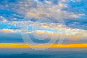 Vibrant color cloud scape on a dramatic sky. Image was captured on a sunny summer day in sunset time. Outdoor travel photography.